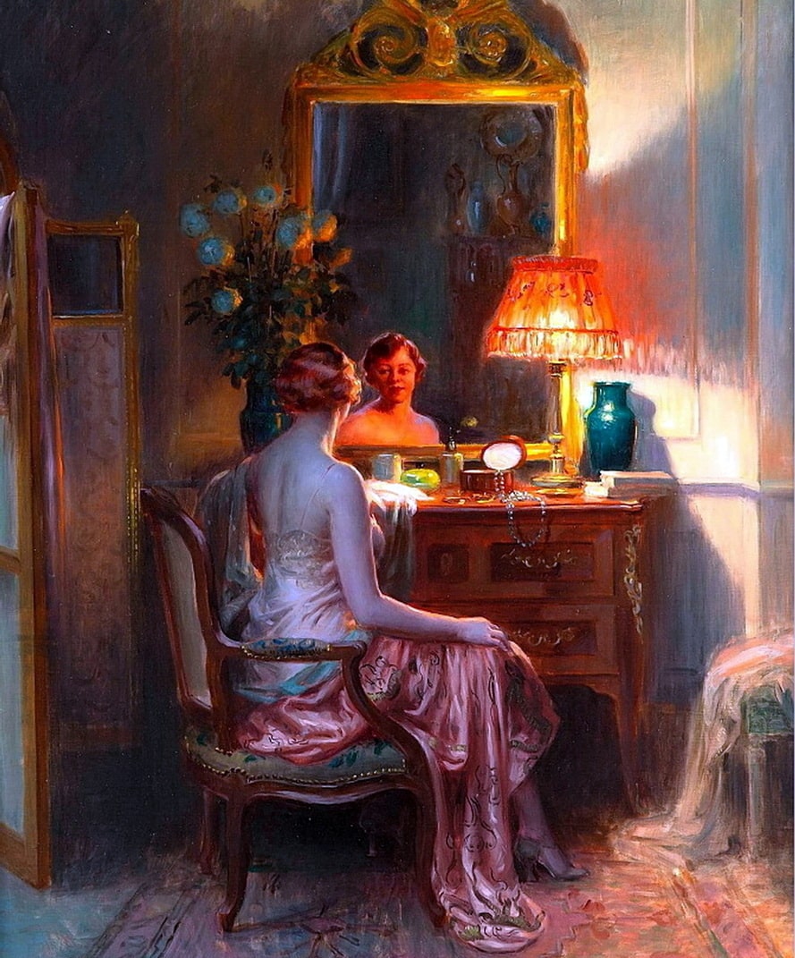 A woman in her bedroom in a pink nighty at her dressing table.