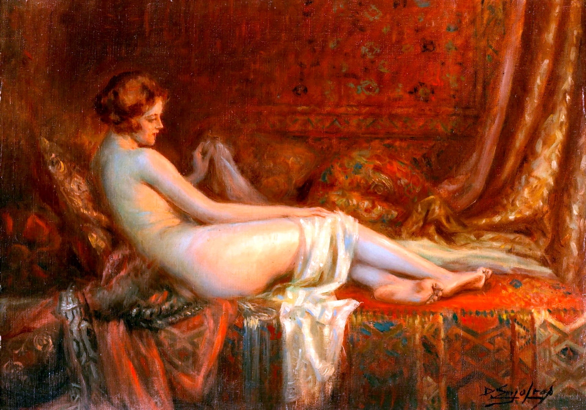 A nude woman on a red couch leaning against a cushion with a white shawl over her legs.