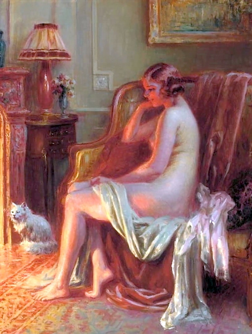 A naked woman is appreciating the warmth of the fire. Her cat is too. On the table behind there are some pretty flowers.