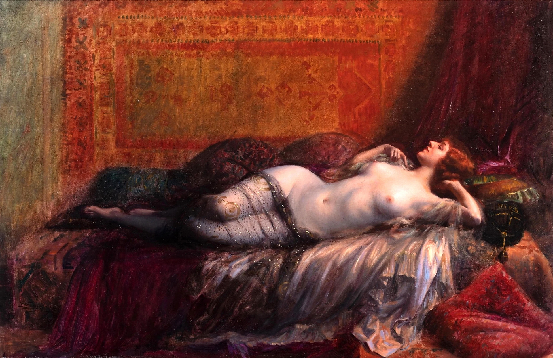 A woman from a harem lying half naked showing lovely bosoms and a very see-through covering over her legs.