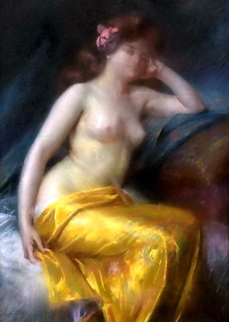 The lady is sitting semi naked with a yellow wrap over her lap. Her sexy bosoms are displayed nicely.