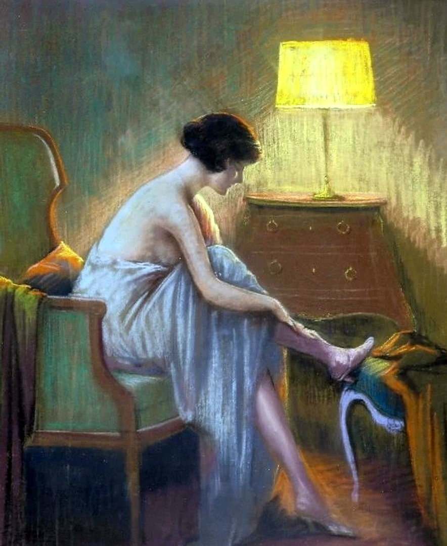 A semi naked lady is making sure her stockings line up straight by adjusting them.