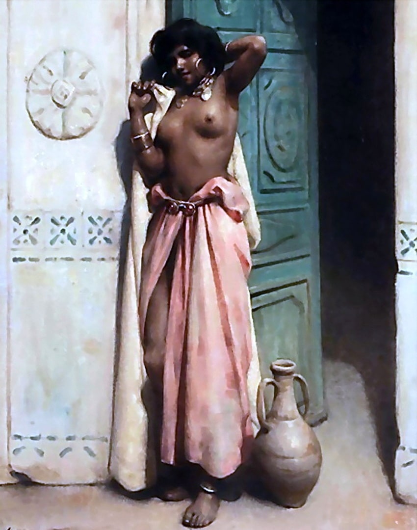 A beautiful woman from a harem standing in a doorway.