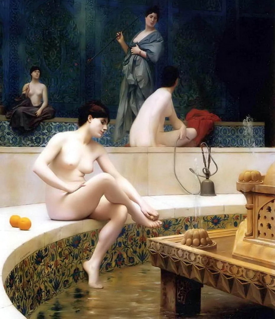 Naked girls sitting around a pool bathing and using a bong.