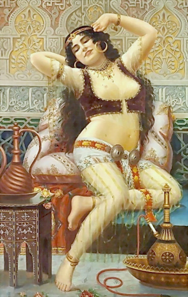 A beautiful woman in a harem having a stretch on a couch showing her sexy breasts.