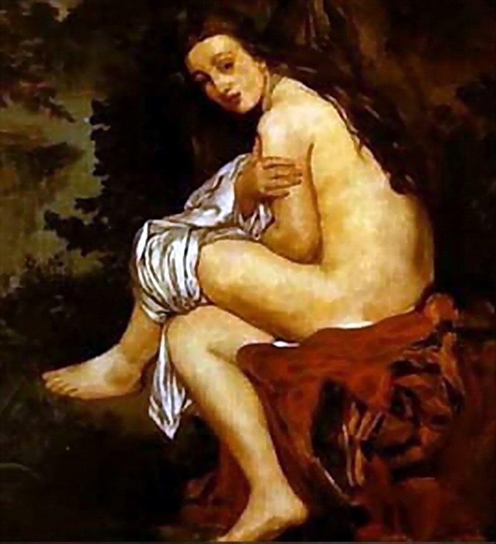 A nymph has just had a bath and idrying herself off with a towel as she sits on a rock